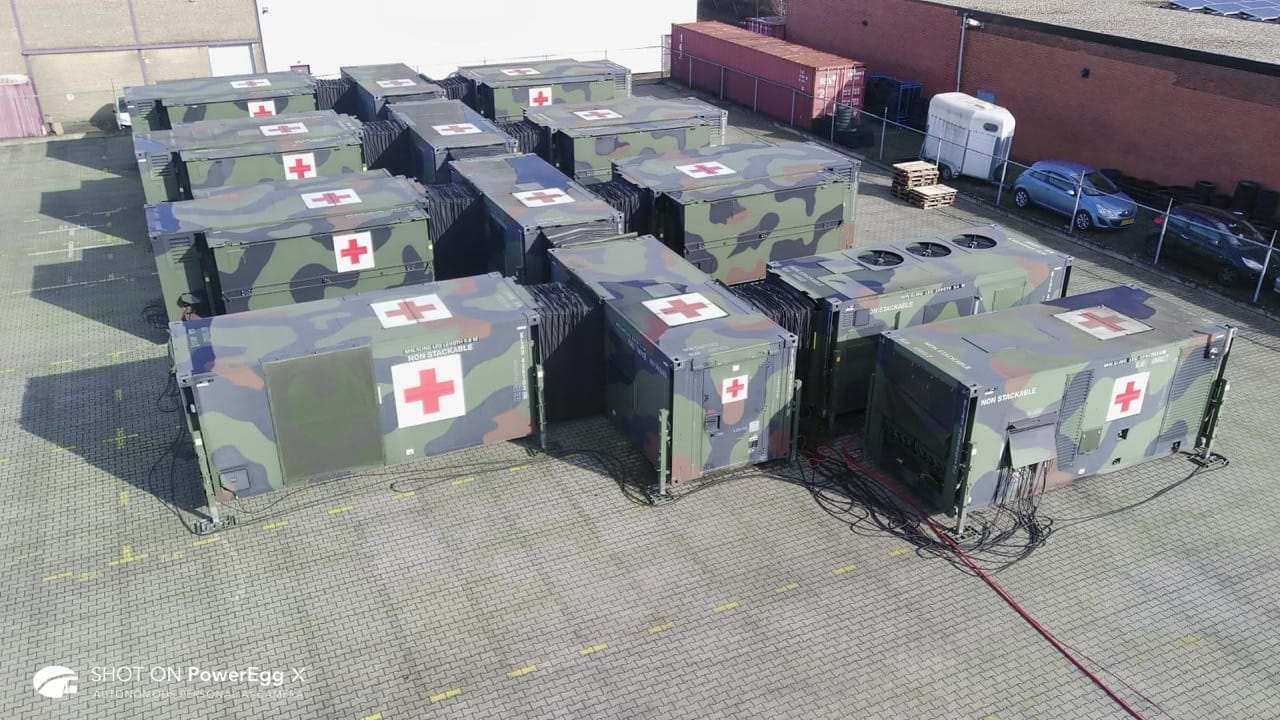 Aerial photograph of the connected field hospital shelters on both sides of the central corridor