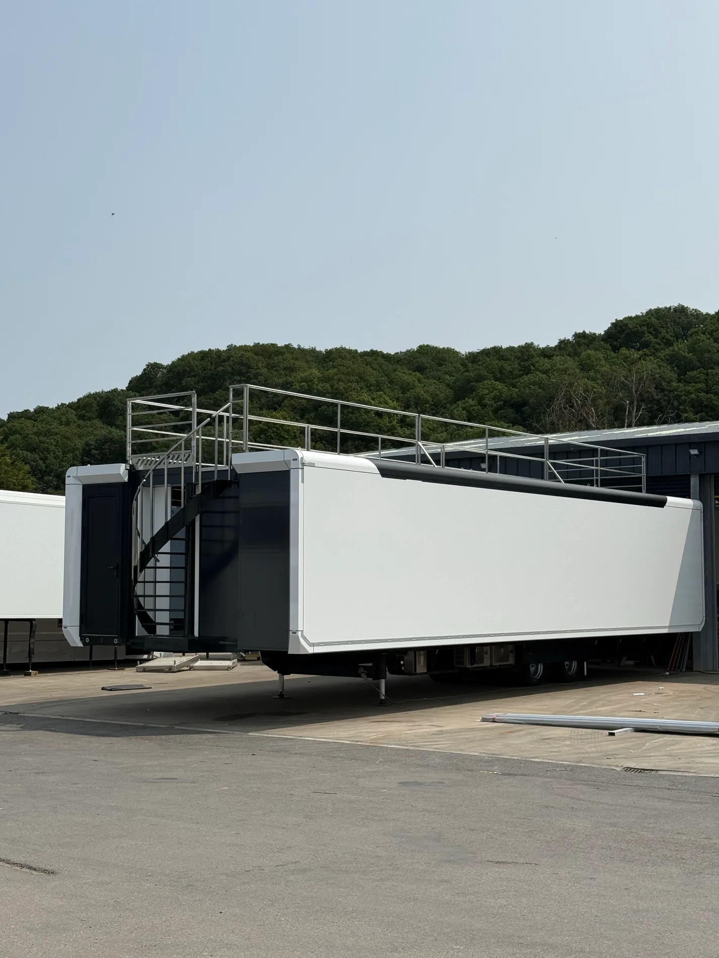 Expandable trailer exterior with optional roof terrace and rear staircase