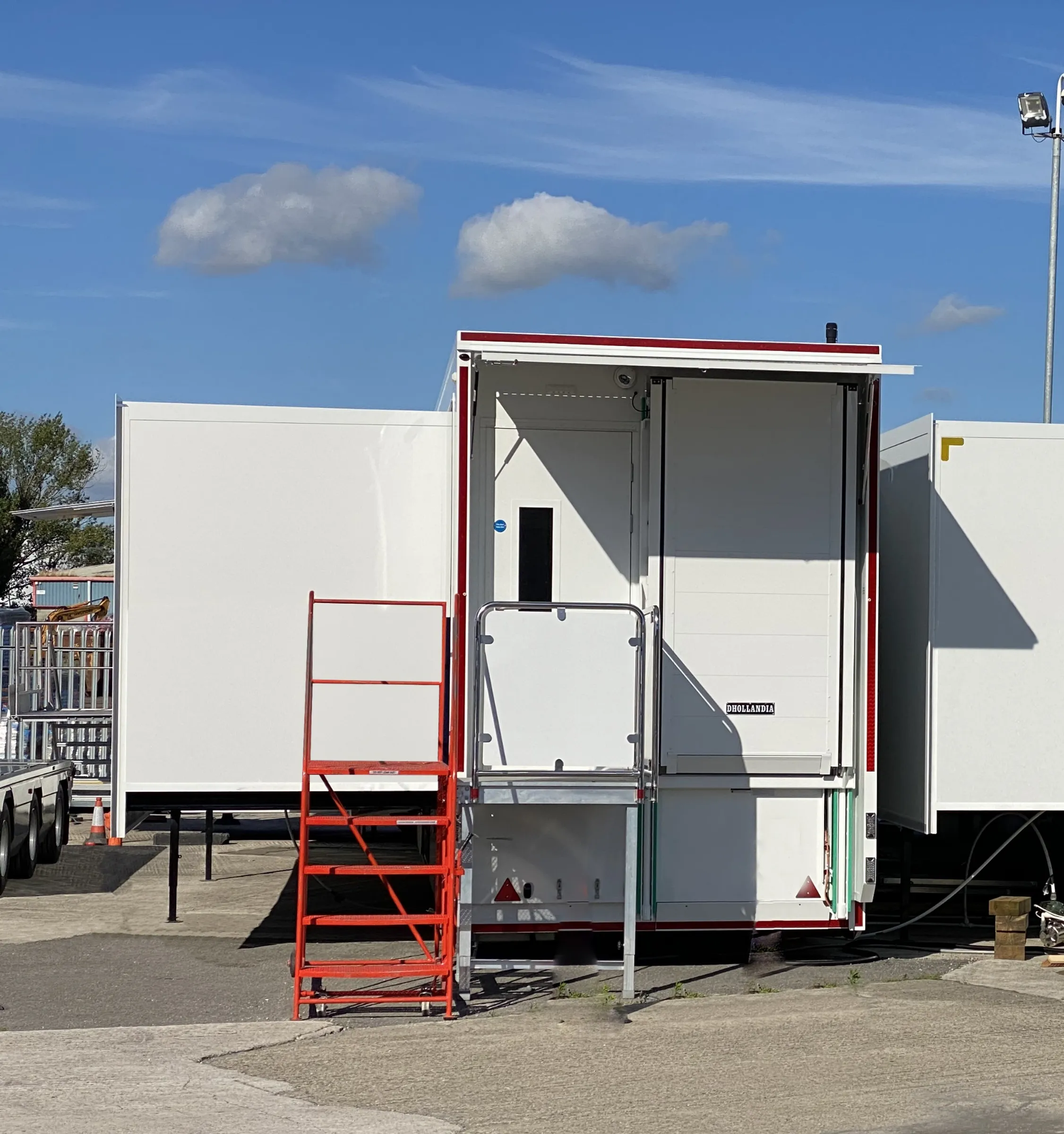 Three connected trailers of the complex with access steps and awning