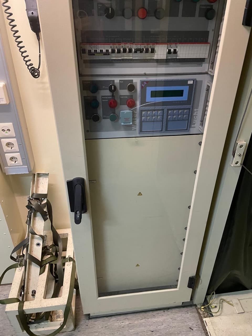 Interior control cabinet with switches, display and circuit breakers