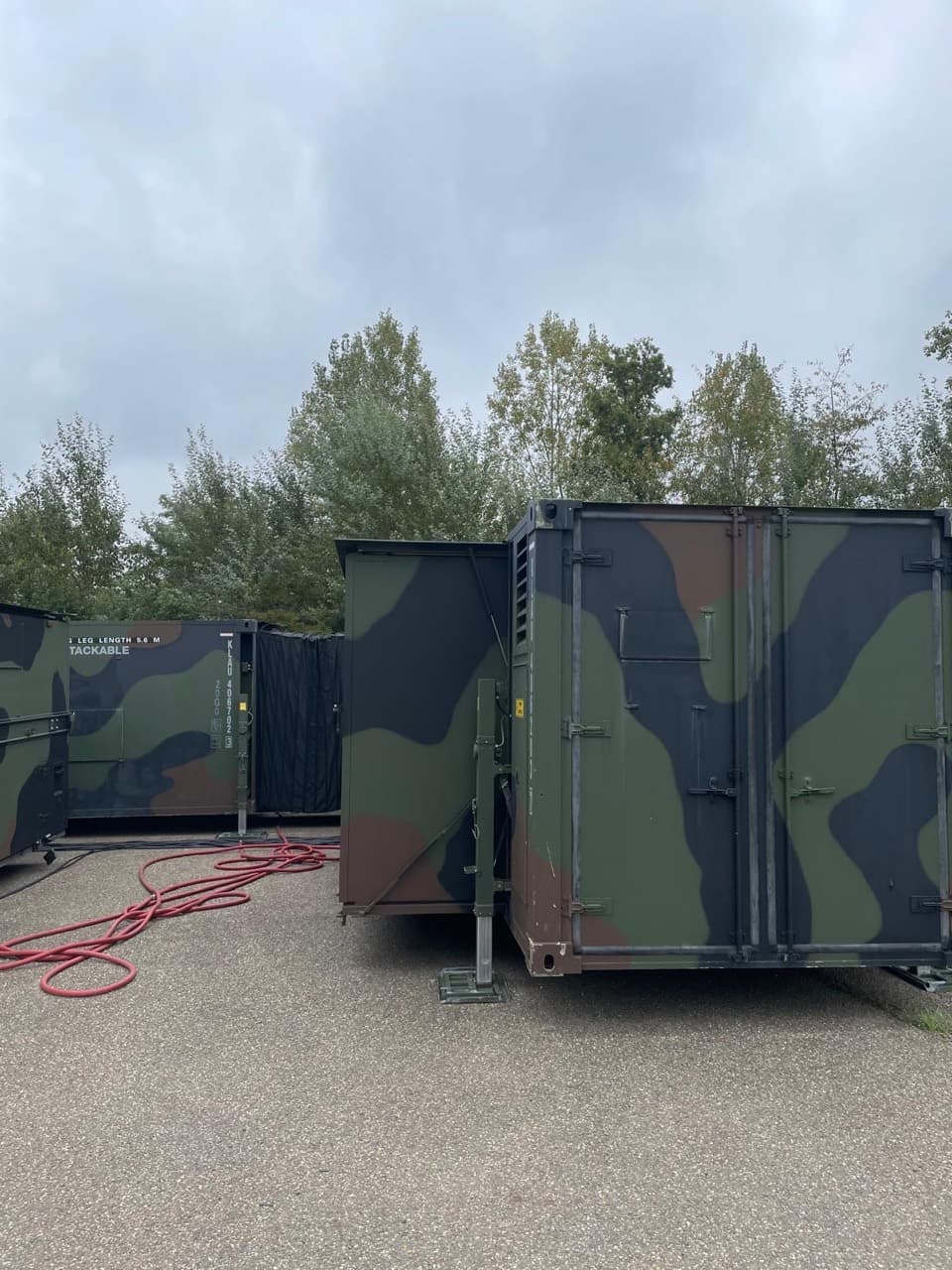 Hospital module end doors beside an extended side section and flexible connection