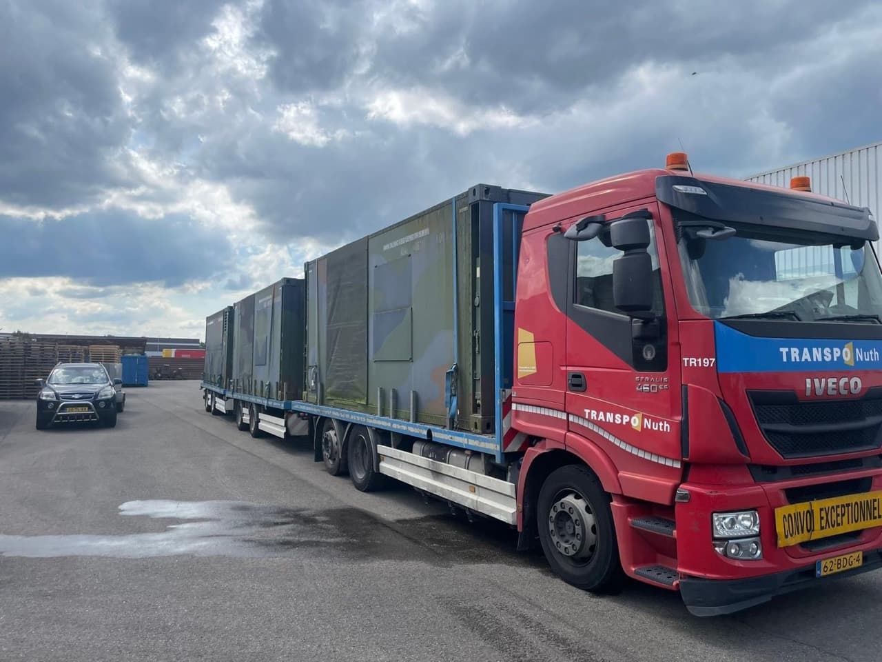 Field hospital modules loaded on a road transport trailer