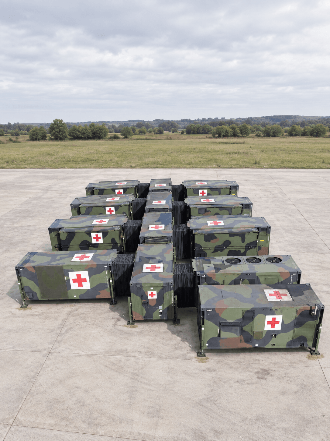 Visualization of a complete field hospital: camouflaged modules marked with red crosses, set out on an apron