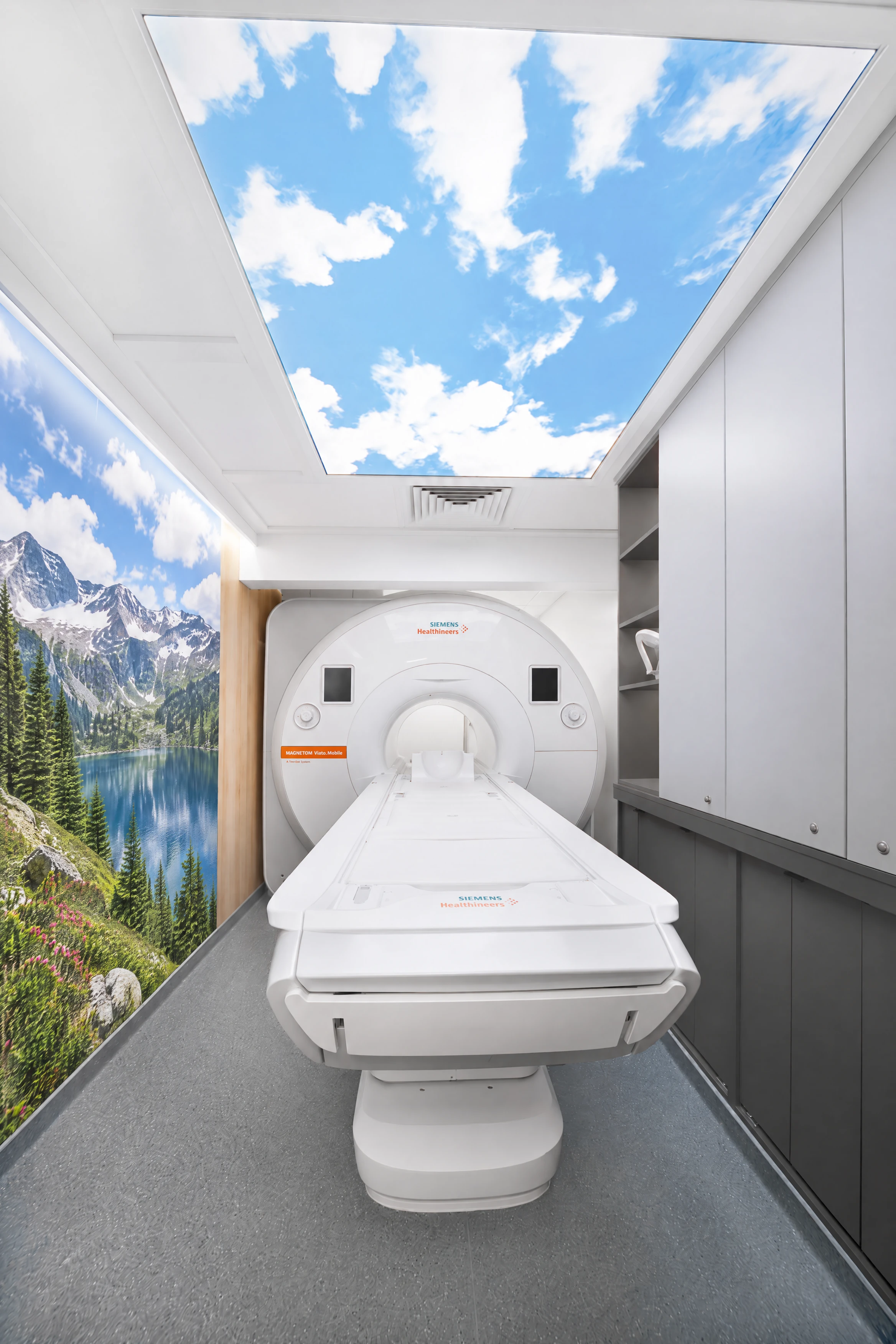 Photo-based mri configuration in a furnished mobile clinic room.