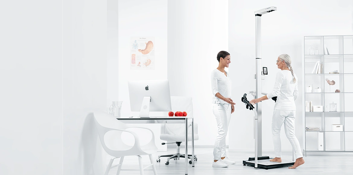 A patient uses the seca body-composition assessment system.