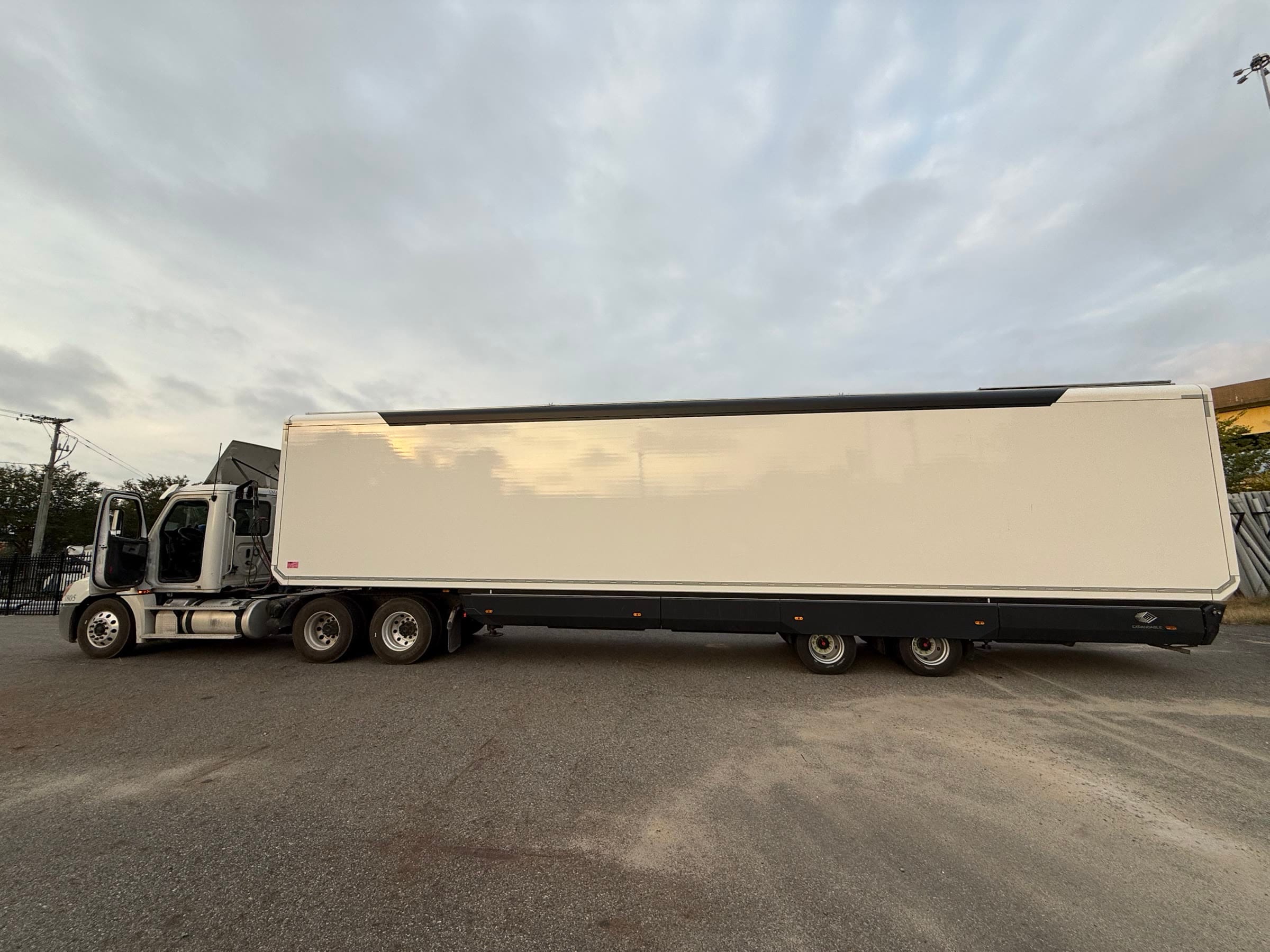 The expandable unit closed for transport, coupled to a tractor unit on arrival