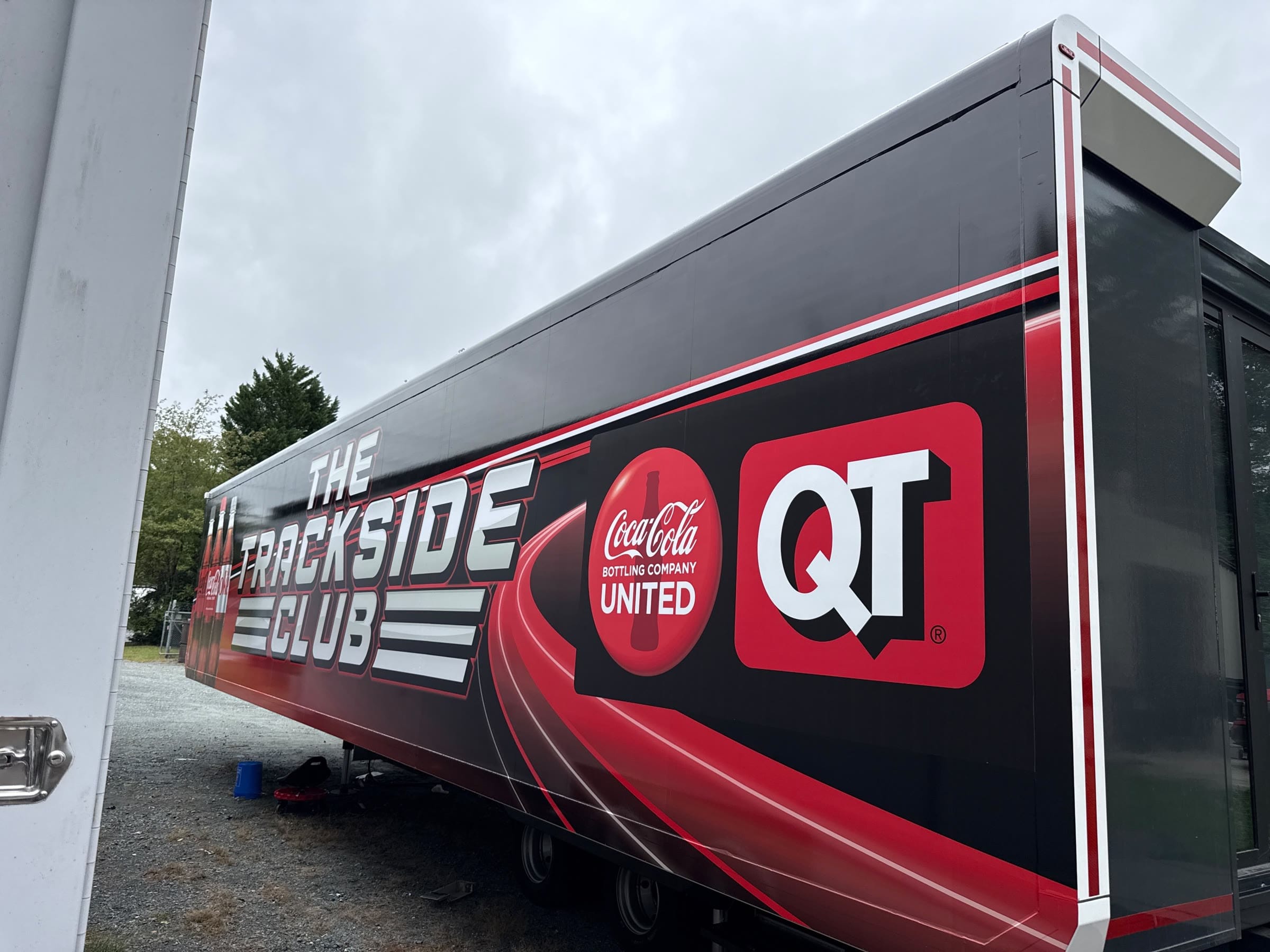 The unit's end section wrapped in red and black Trackside Club graphics