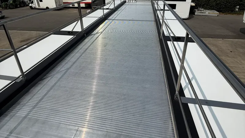 Optional expandable trailer roof terrace with decking and perimeter railings