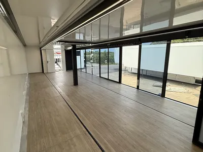 Expandable trailer interior looking along the glazed side