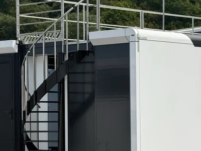 Expandable trailer rear access and exterior finish