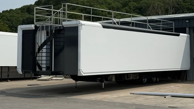 Expandable trailer exterior with optional roof terrace and external staircase