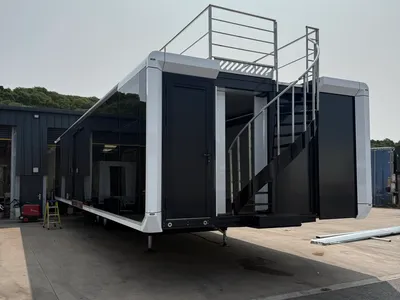 Expandable trailer glazed side and optional rear staircase