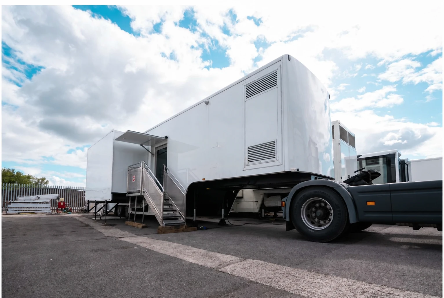 Mobile laboratory deployed with side pod and access stairs